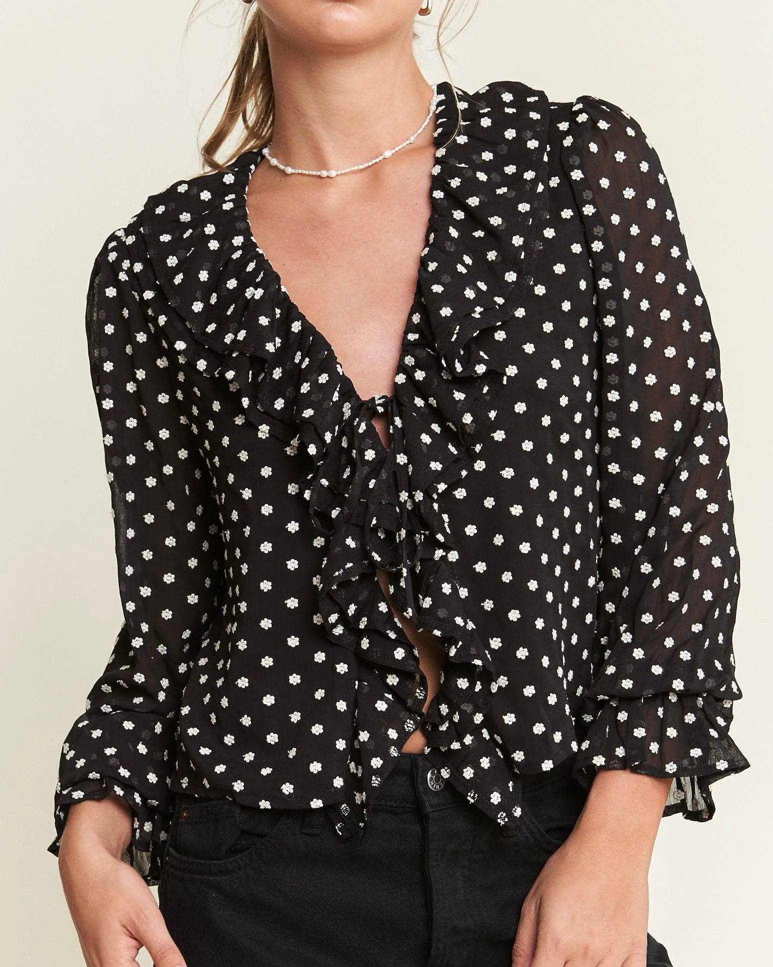 Front Tie Ruffled Semi Sheer Micro Floral Top in Black