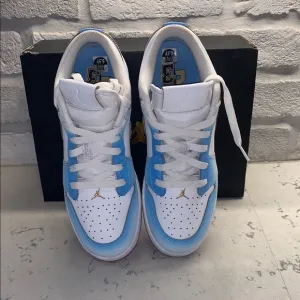 Jordan 1 Low SE &quot;White/Game Royal/University Blue&quot; Grade School Boys' Shoe