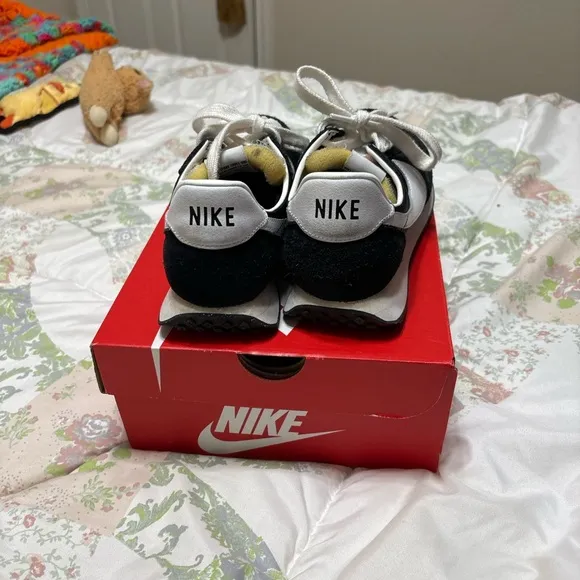 Nike size 5 youth sneakers black with white check.