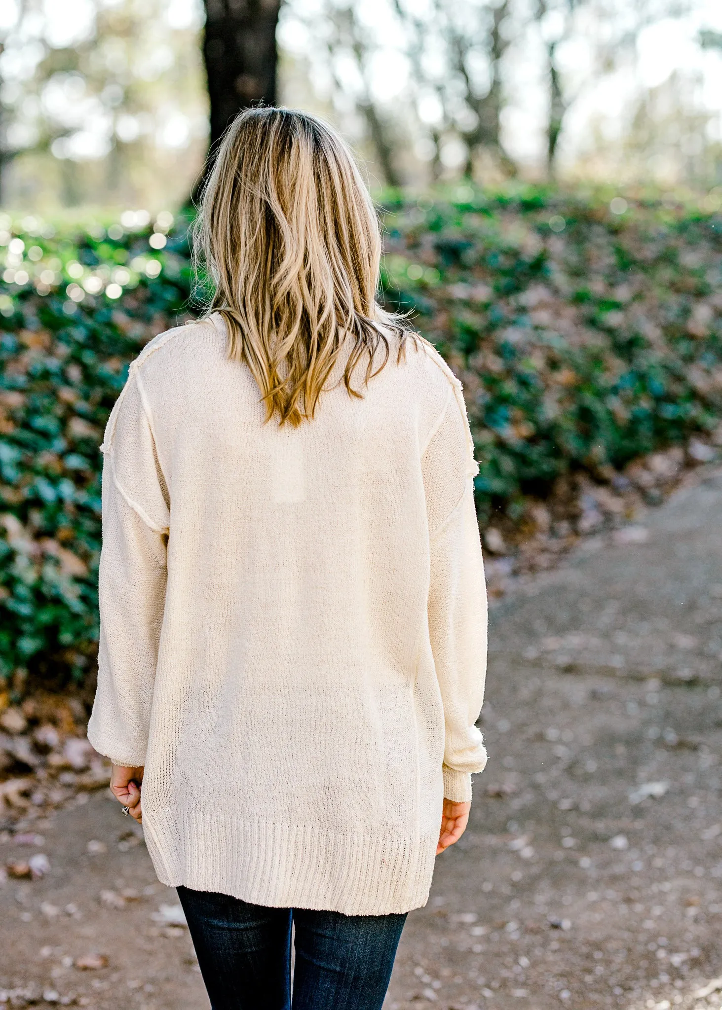 X Milky Round Neck Sweater